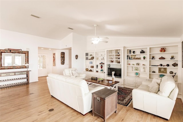 living room with light wood-type flooring, ceiling fan, and vaulted ceiling