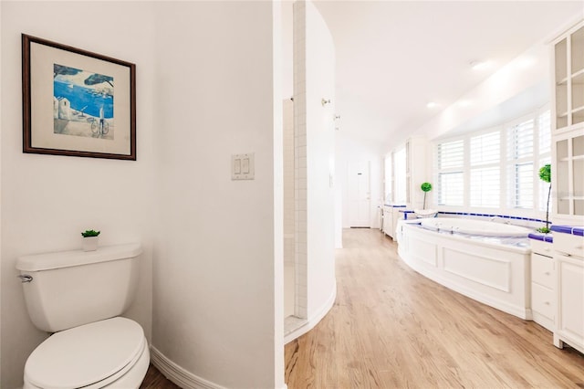 full bathroom featuring vanity, toilet, separate shower and tub, and hardwood / wood-style floors