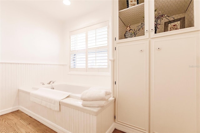 bathroom featuring a bathtub and hardwood / wood-style floors