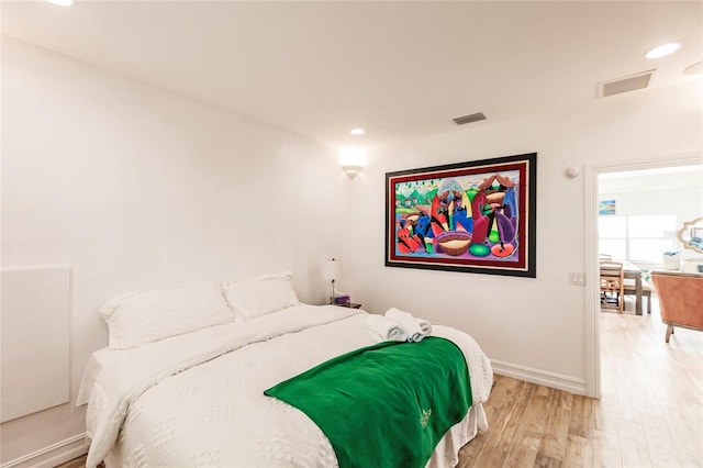 bedroom with light hardwood / wood-style flooring