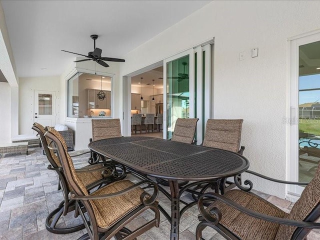 view of patio / terrace featuring ceiling fan