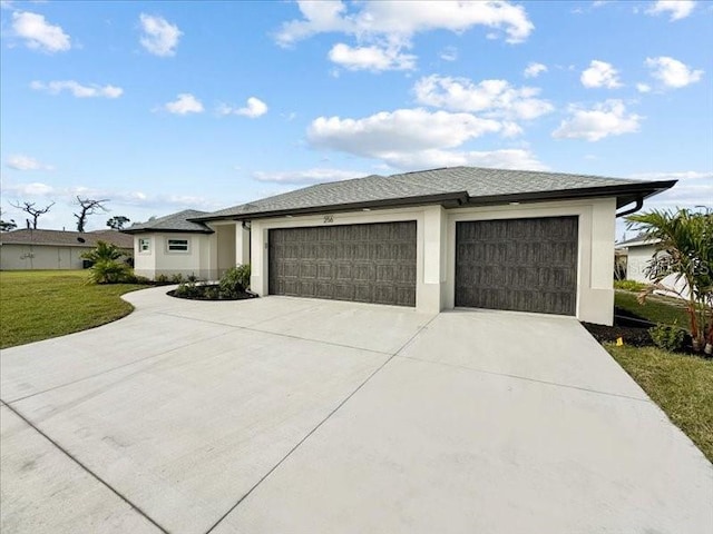 view of front of house with a garage and a front yard