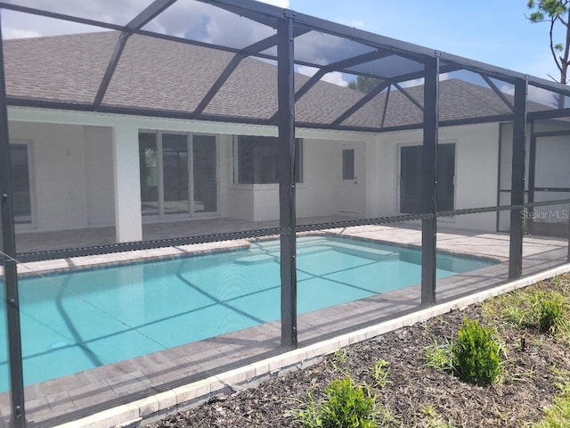 261 Broadmoor Ln, Rotonda West, FL 33947 - outdoor pool with glass enclosure and a patio
