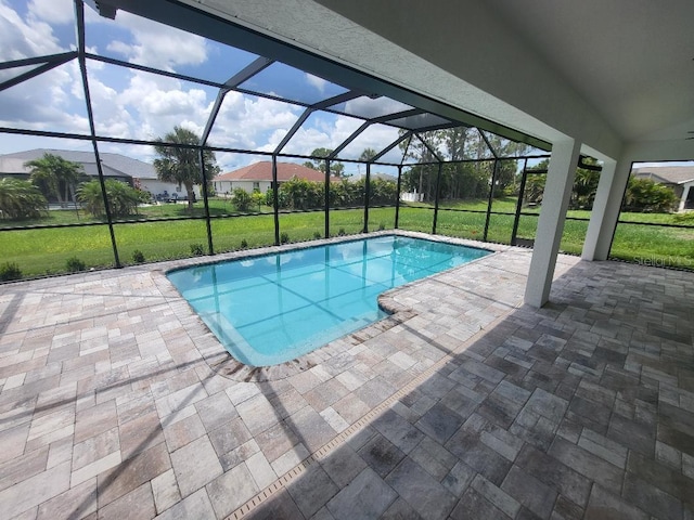 261 Broadmoor Ln, Rotonda West, FL 33947 - outdoor pool with a lawn, a patio, and a lanai
