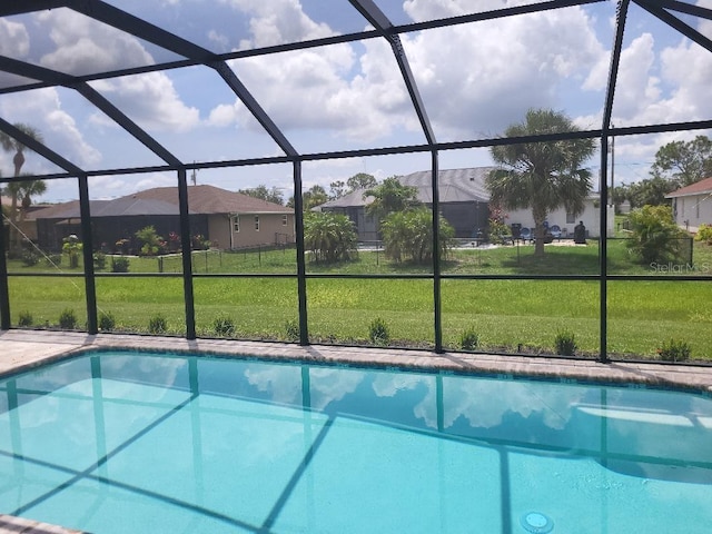 261 Broadmoor Ln, Rotonda West, FL 33947 - swimming pool with a lanai, a yard, and a residential view