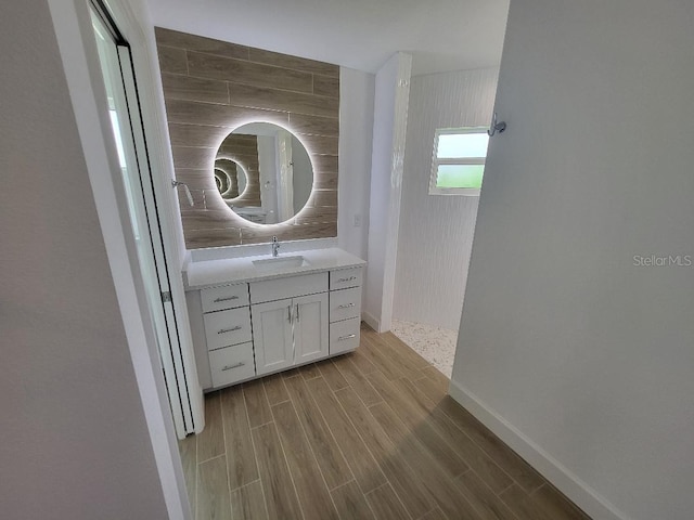 261 Broadmoor Ln, Rotonda West, FL 33947 - bathroom with vanity, wood finished floors, and walk in shower