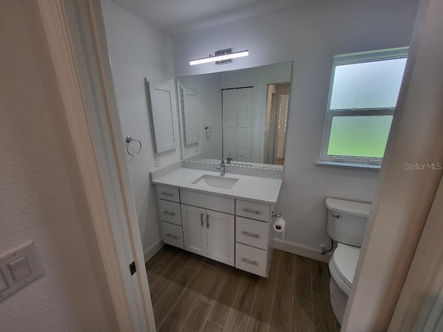 261 Broadmoor Ln, Rotonda West, FL 33947 - bathroom featuring wood tiled floors and vanity