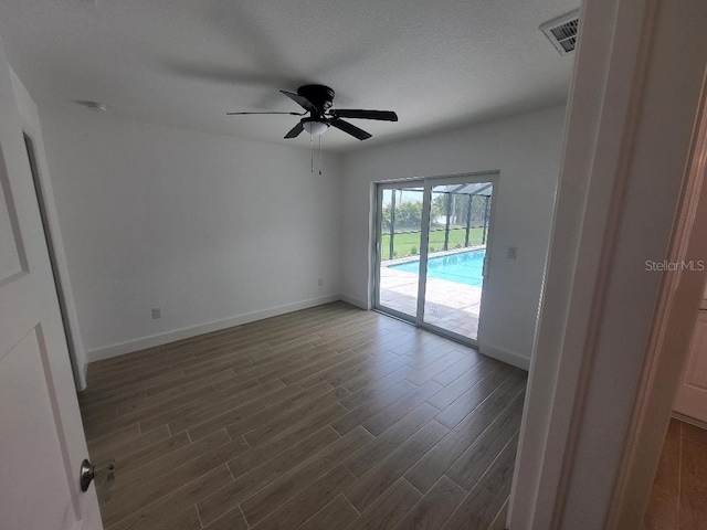 261 Broadmoor Ln, Rotonda West, FL 33947 - unfurnished room featuring ceiling fan and dark wood-style floors