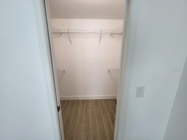 261 Broadmoor Ln, Rotonda West, FL 33947 - spacious closet featuring wood finished floors