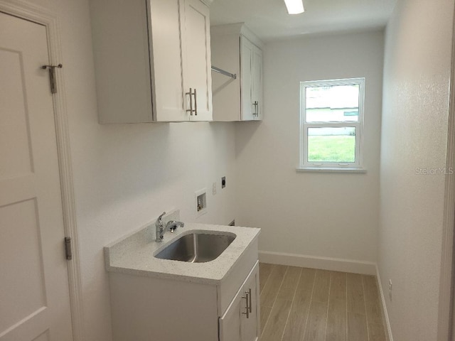 261 Broadmoor Ln, Rotonda West, FL 33947 - washroom featuring hookup for an electric dryer, cabinet space, light wood-style floors, and washer hookup