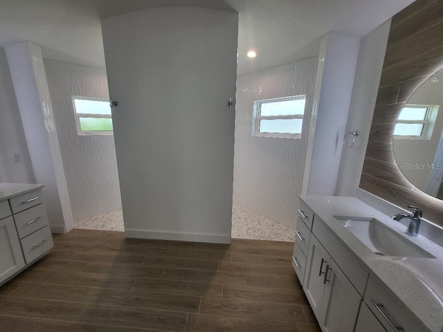 261 Broadmoor Ln, Rotonda West, FL 33947 - full bathroom with walk in shower, vanity, plenty of natural light, and recessed lighting