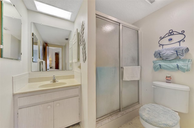 bathroom featuring a textured ceiling, toilet, an enclosed shower, tile patterned flooring, and vanity