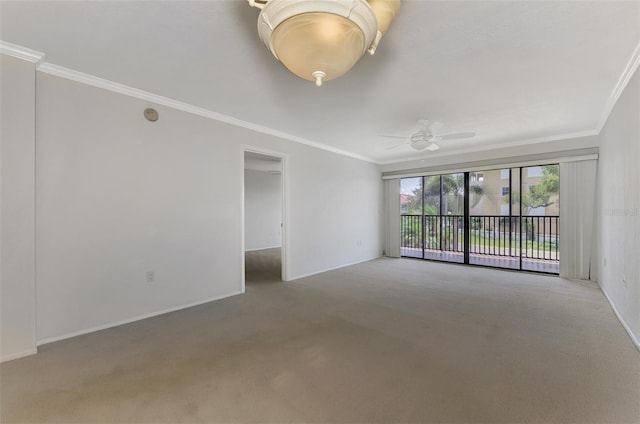 unfurnished room with ceiling fan, ornamental molding, carpet flooring, and baseboards