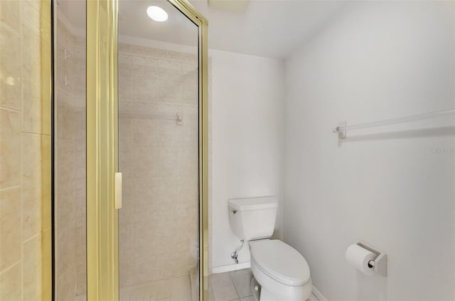 bathroom with toilet, a shower with door, and tile patterned flooring