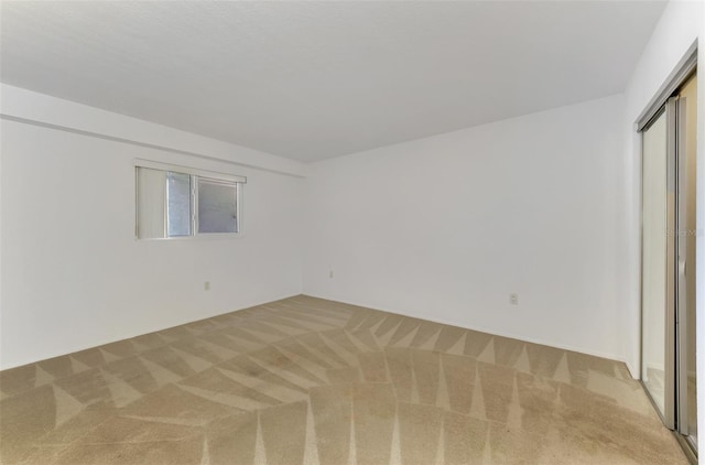 unfurnished bedroom featuring a closet and carpet flooring