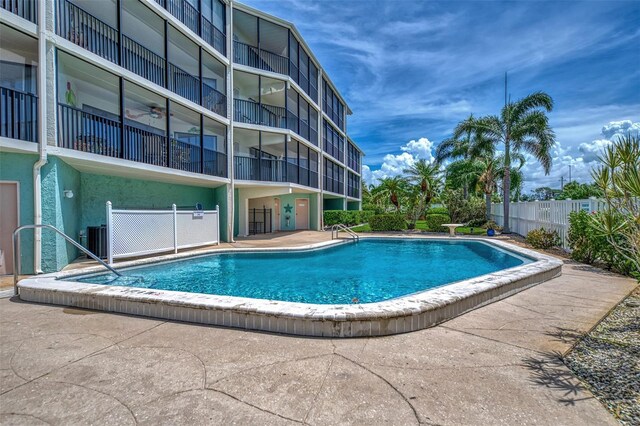 view of swimming pool featuring a patio and central AC unit