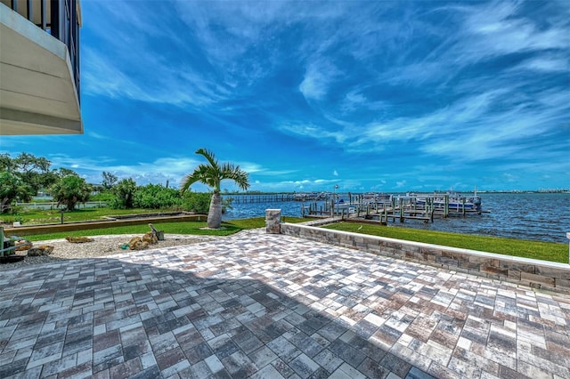 view of patio featuring a boat dock and a water view