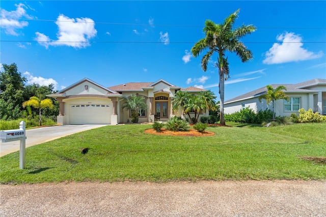 view of front of house featuring a front yard and a garage