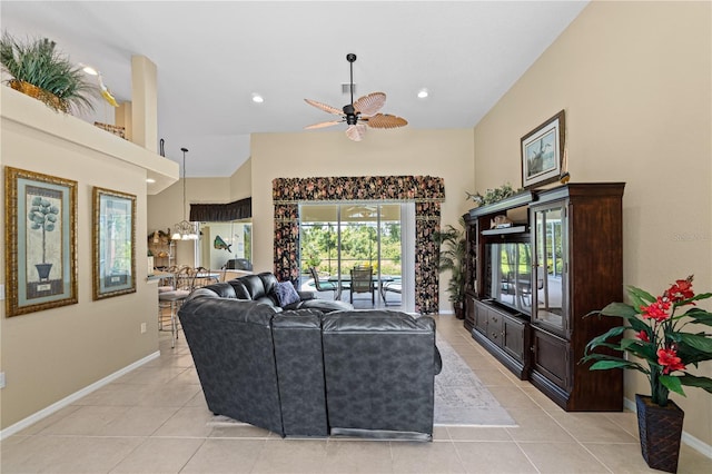 living room featuring light tile patterned floors and ceiling fan