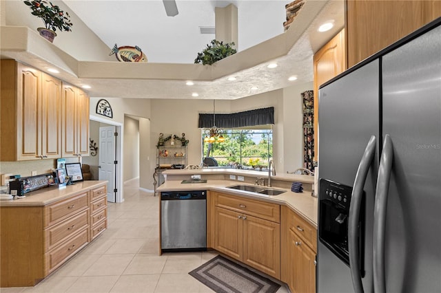 kitchen with an inviting chandelier, sink, light tile patterned floors, decorative light fixtures, and stainless steel appliances