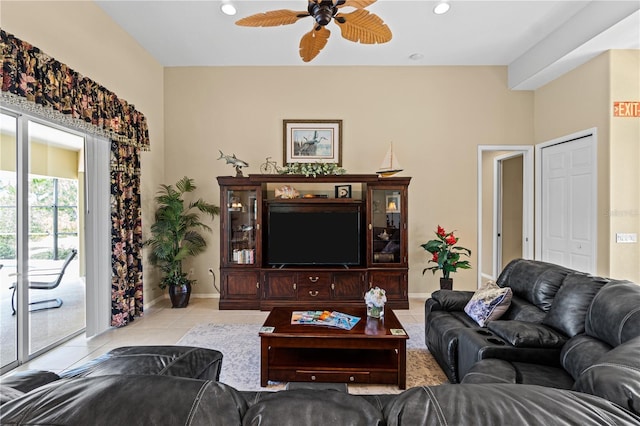 living room featuring ceiling fan and light tile patterned flooring