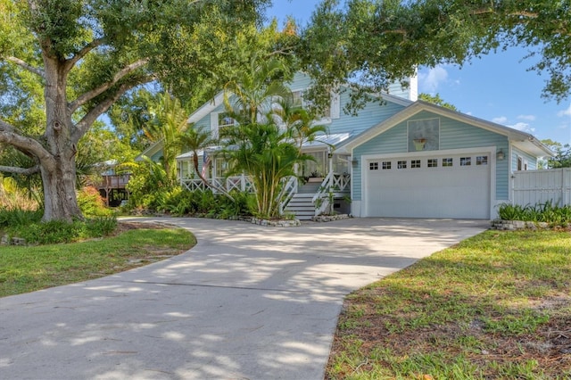 view of front of property with a garage and covered porch