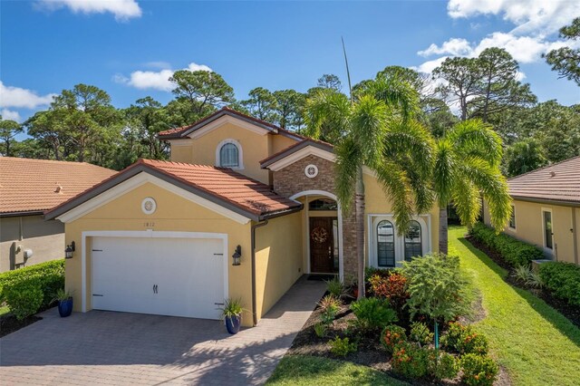 mediterranean / spanish-style home featuring a garage