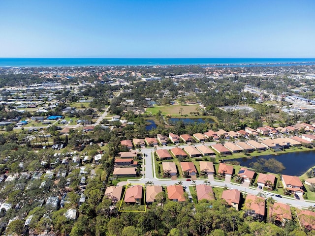 aerial view with a water view and a residential view