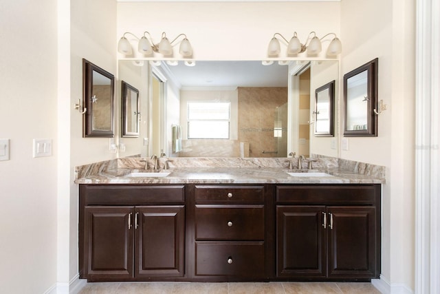 full bath with double vanity, walk in shower, and a sink