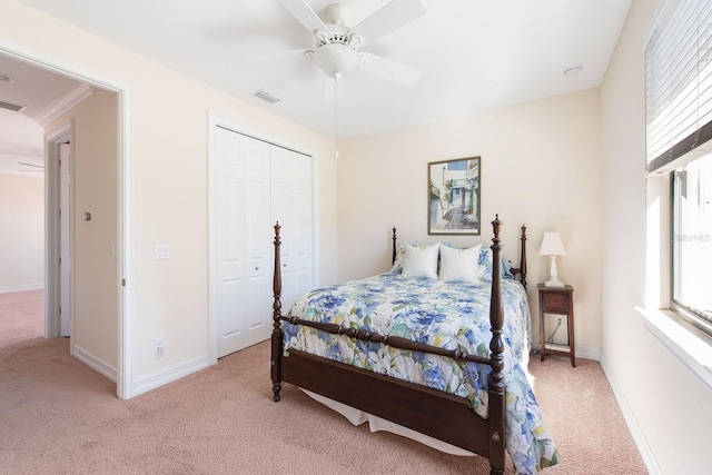 bedroom with baseboards, multiple windows, visible vents, and light colored carpet