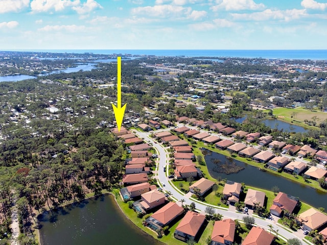 bird's eye view featuring a water view and a residential view