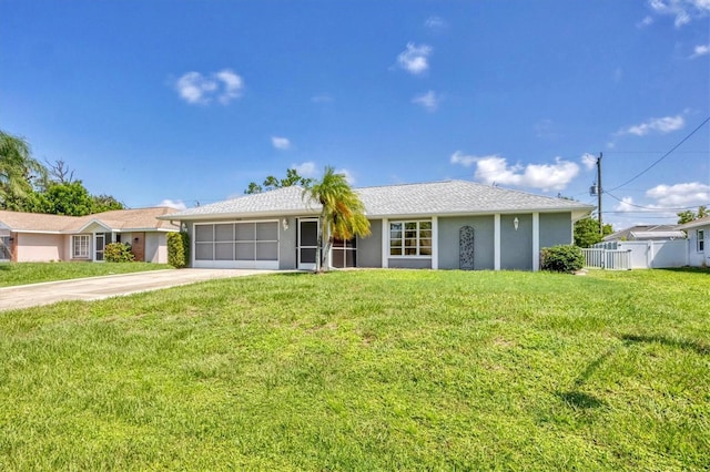 ranch-style home with a front yard and a garage