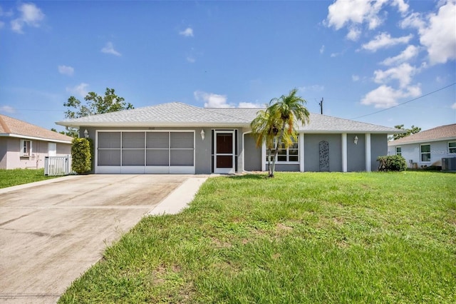 ranch-style house featuring central AC, a front yard, and a garage