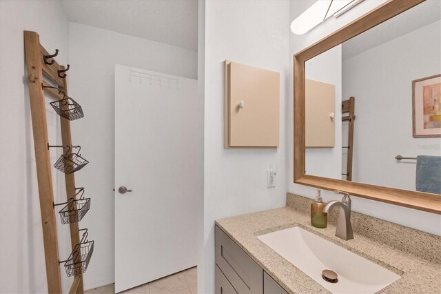 bathroom featuring vanity and tile patterned flooring