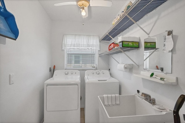 laundry room with laundry area, ceiling fan, a sink, and washing machine and clothes dryer