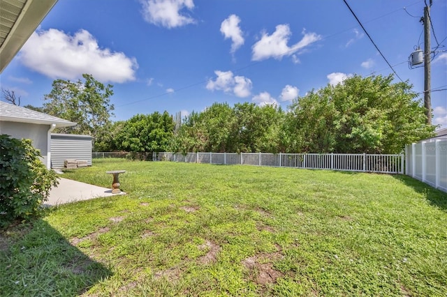 view of yard with a patio and a fenced backyard