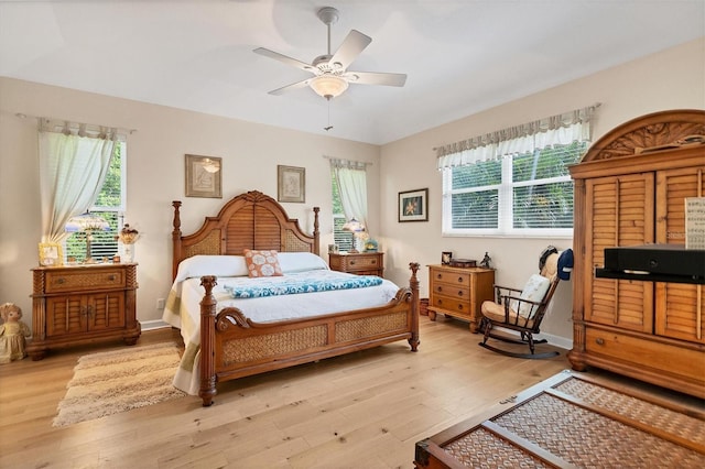 bedroom featuring ceiling fan and light hardwood / wood-style flooring