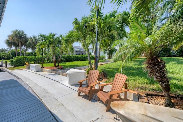 view of community featuring a patio and a yard