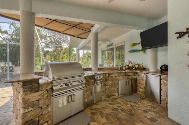 view of patio featuring sink and area for grilling