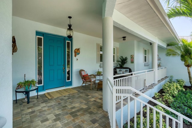 doorway to property featuring covered porch