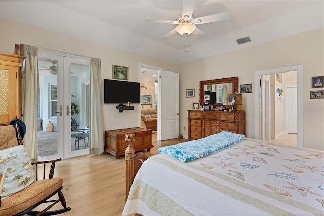 bedroom featuring french doors, access to outside, ceiling fan, and light hardwood / wood-style flooring