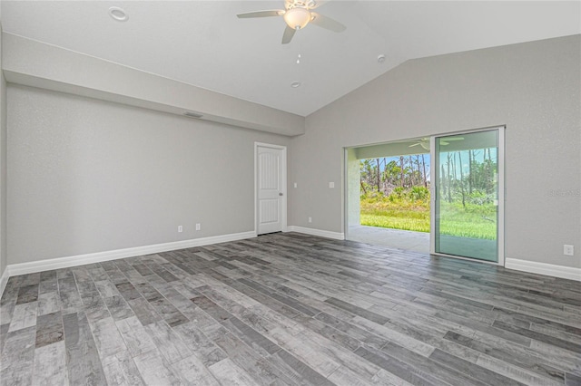 unfurnished room with ceiling fan, hardwood / wood-style floors, and lofted ceiling