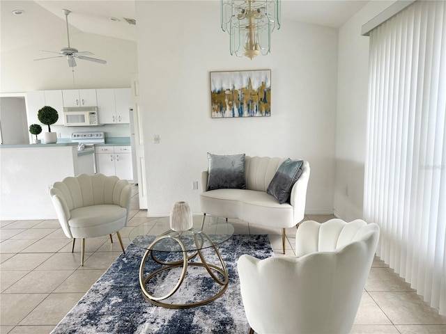 living room featuring a ceiling fan, high vaulted ceiling, and light tile patterned floors