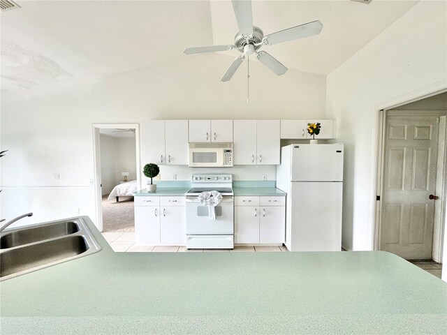 kitchen featuring sink, high vaulted ceiling, white cabinets, light colored carpet, and white appliances