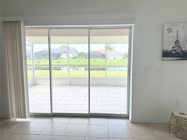 doorway to outside featuring light tile patterned floors