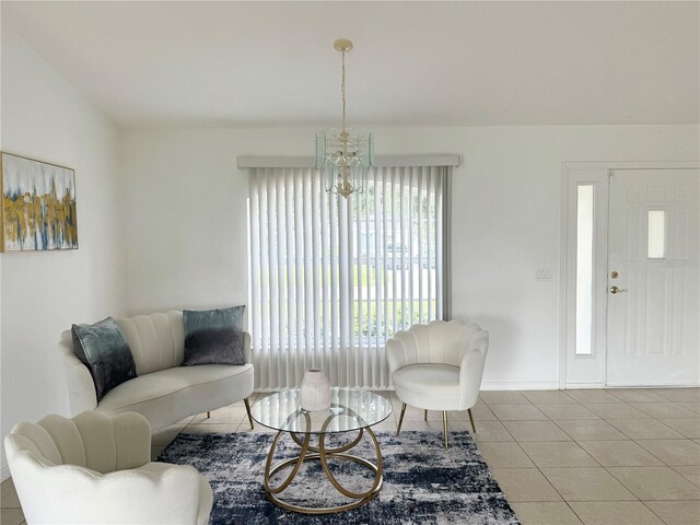 tiled living room with a chandelier