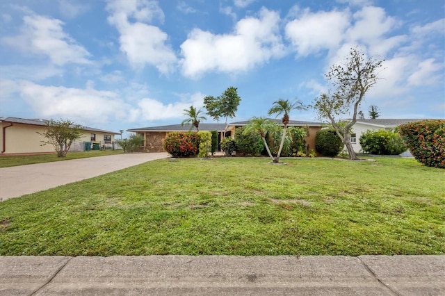 ranch-style house featuring a front lawn