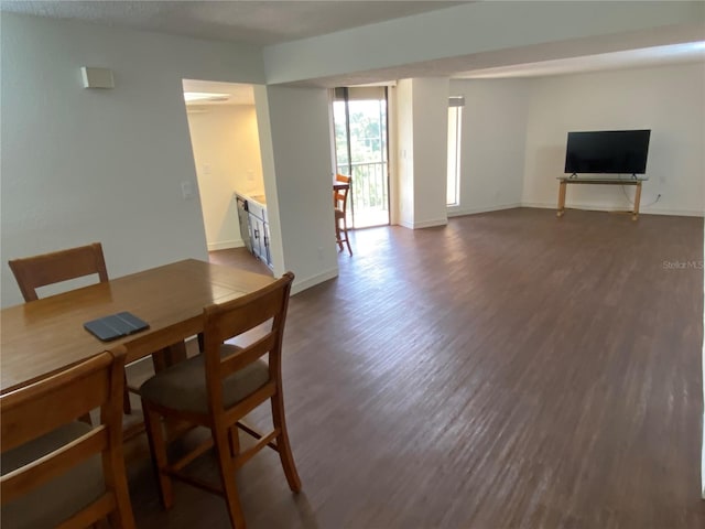 dining space featuring dark hardwood / wood-style floors