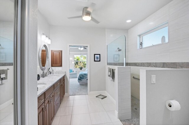 bathroom with double vanity, walk in shower, plenty of natural light, and ensuite bath