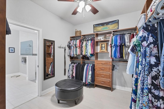 spacious closet with a ceiling fan